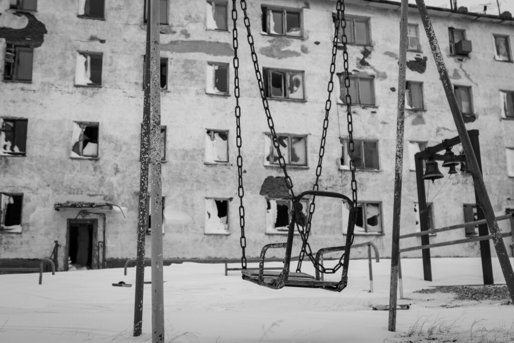 Grayscale Photography of Metal Swing